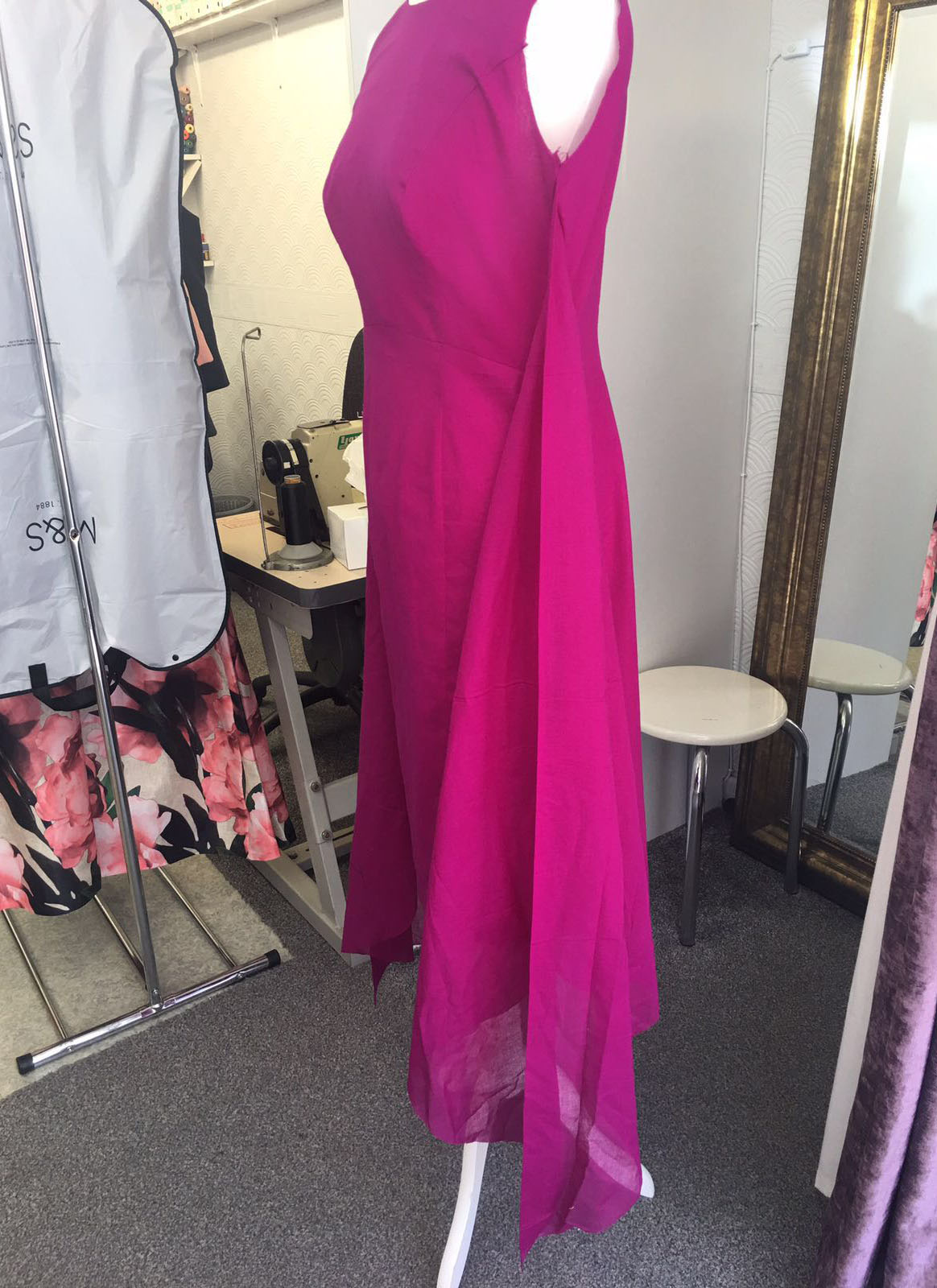 Flowing fuchsia evening gown with elegant draping